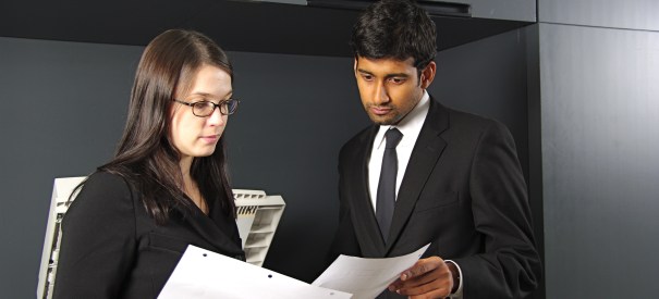 Two people by copier